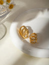 Boucles d’Oreilles Double Anneau Entrelacé en Acier Inoxydable Doré – Élégance Moderne – Écrin Offert "Lyna" - Mara Bijoux
