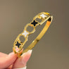 Bracelet Jonc Doré – 2 Trèfles Noirs & 2 Blancs – Acier Inoxydable Femme + Écrin Offert "Ginger Doré" - Mara Bijoux