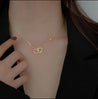 Collier Double Cœur Entrelacé en Acier Inoxydable Doré – Écrin Offert "Coraçao" - Mara Bijoux